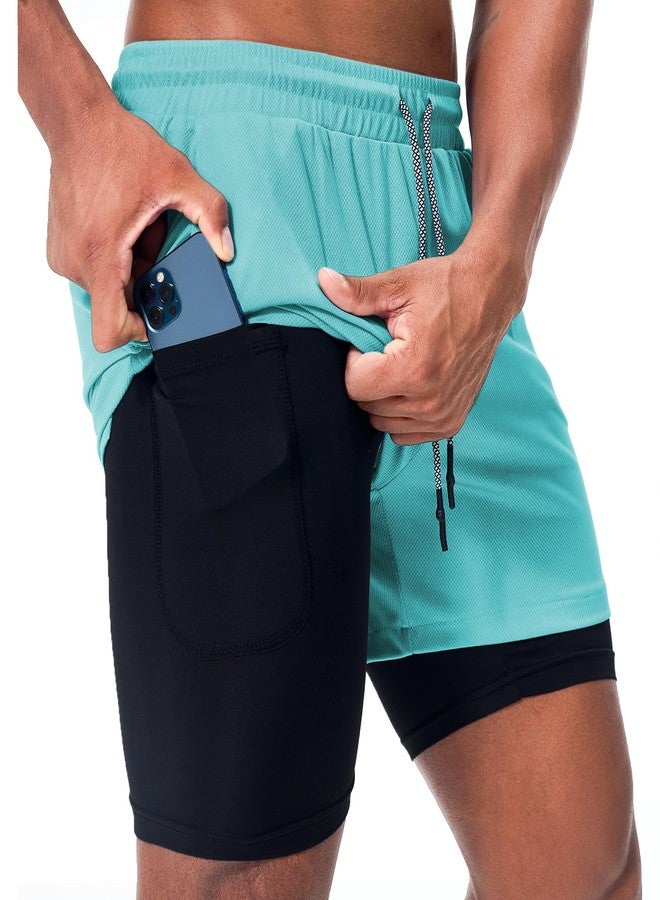 Surenow شورت رياضي رجالي من Surenow، سريع الجفاف، مناسب للتمارين الرياضية، شورت 2 في 1، طوله 5 بوصات، مناسب للجري والتمارين الرياضية، مزود بجيب للهاتف، لون أزرق مخضر. - Image 1